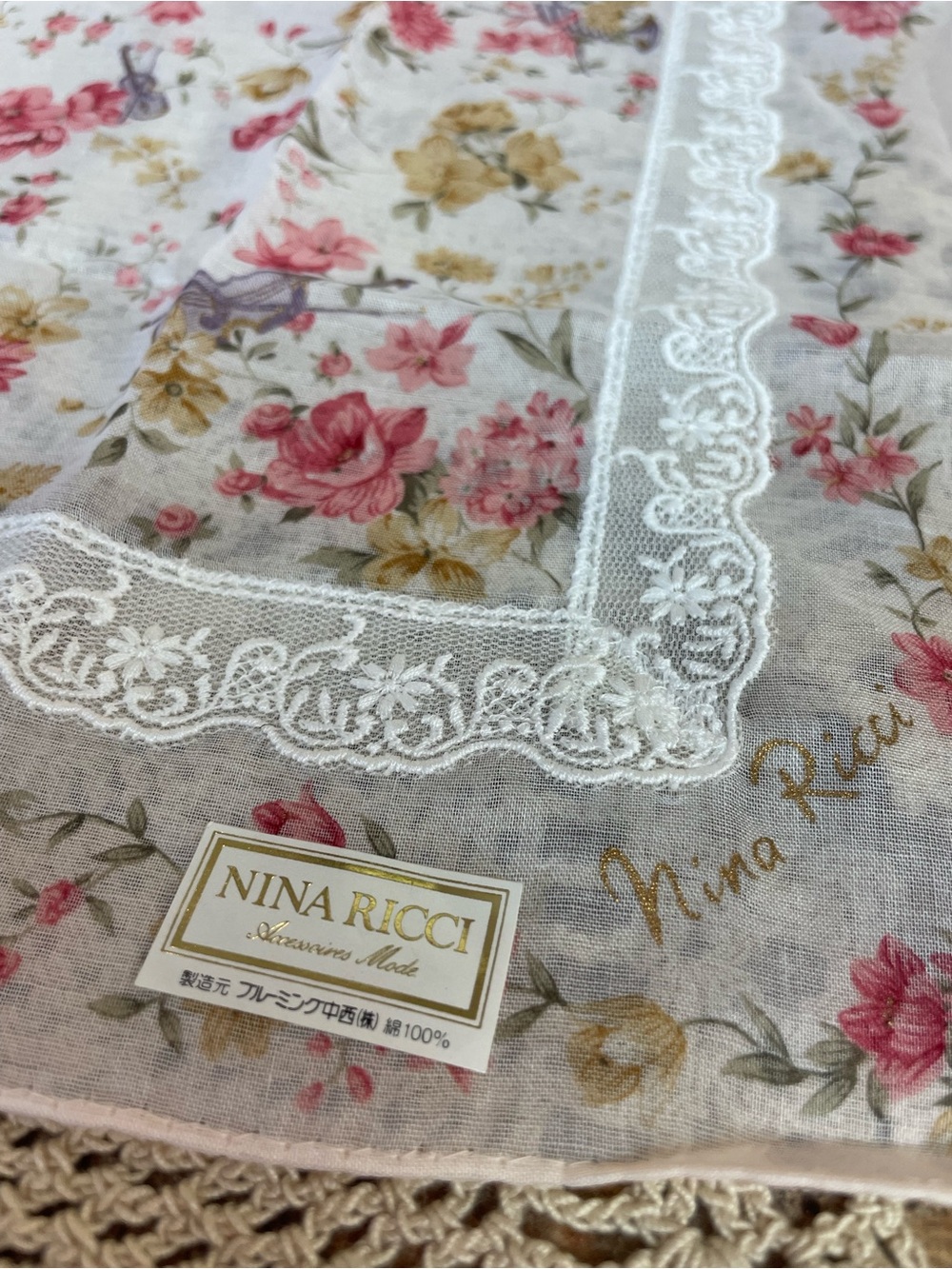 Nina Ricci handkerchief featuring a floral print, butterfly and lace detailing